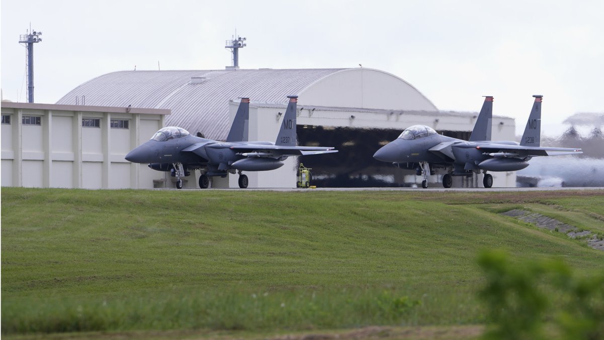 U.S F-15 fighters are parked at the Kadena Air Base airfield in Kadena town, Okinawa, Japan, Aug. 24, 2023. (AP Photo)