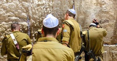 View of Israeli soldiers praying in front of the Western Wall, East Jerusalem, occupied Palestine, May 21, 2018. (Shutterstock Photo)