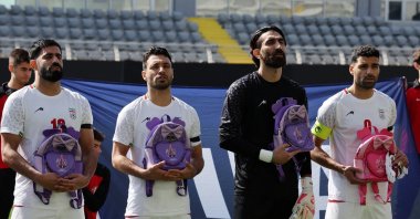 Iranian players hold school bags in memory of the victims of the U.S. bombing of a girls' school in Iran's Minab, Antalya, Türkiye, March 27, 2026. (Reuters Photo)