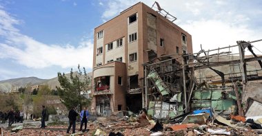 Officials and media gather around the Shahid Beheshti University after it was damaged in U.S.-Israeli airstrikes, in Tehran, Iran, April 4, 2026. (AFP Photo)