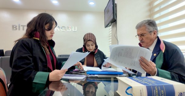 Three lawyers review legal documents, Bitlis, Türkiye, April 1, 2026. (AA Photo)
