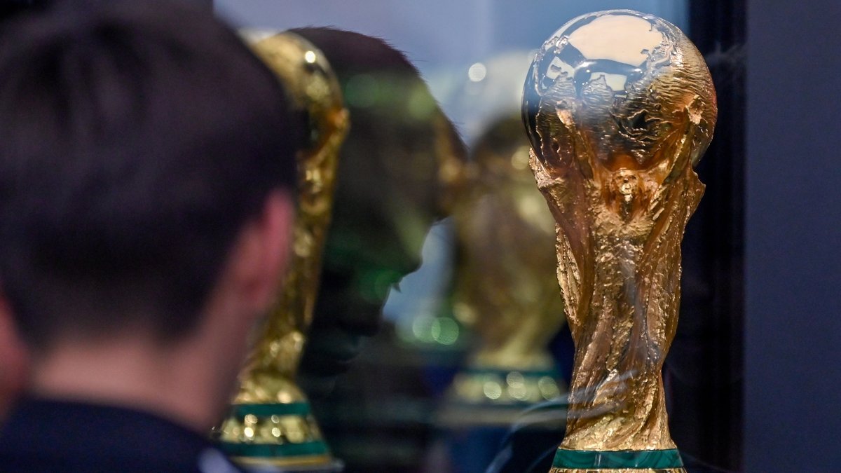 A person looks at the FIFA World Cup trophy at BBVA Stadium, Monterrey, Mexico, March 14, 2026. (EPA Photo)