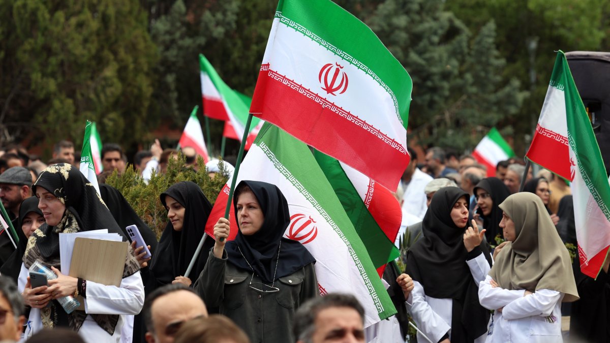 Members of Iranian health care personnel holding Iranian flags take part in a protest against U.S.-Israeli attacks in Tehran, Iran, April 6, 2026. (EPA Photo)