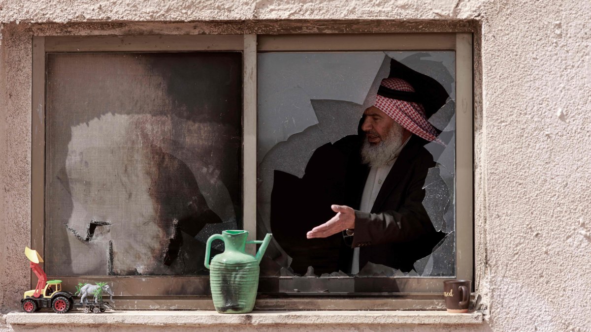 An elderly Palestinian man stands inside a house that was destroyed following an Israeli settler attack on the outskirts of al-Lubban ash-Sharqiya village, south of Nablus in the occupied West Bank, Palestine, April 6, 2026. (AFP Photo)