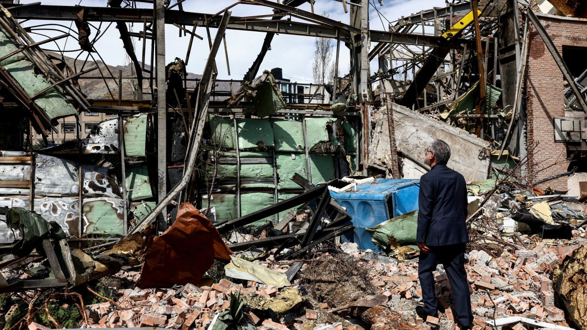 Iran's Minister of Science Hossein Simaee Sarraf inspects the damage at the research building of the Shahid Beheshti University, which was damaged by a strike, amid the U.S.-Israeli conflict with Iran, in Tehran, Iran, April 4, 2026.  (West Asia News Agency via Reuters)