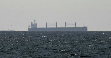 A cargo ship in the Gulf, near the Strait of Hormuz, as seen from northern Ras al-Khaimah, near the border with Oman’s Musandam governance, amid the U.S.-Israeli conflict with Iran, in the United Arab Emirates, March 11, 2026. (Reuters Photo)
