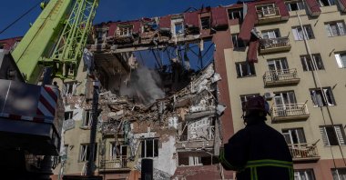 Ukrainian rescuers work at the site of a heavily damaged residential building following a Russian strike in Odesa, Ukraine, April 6, 2026. (AFP Photo)