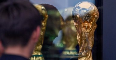 A person looks at the FIFA World Cup trophy at BBVA Stadium, Monterrey, Mexico, March 14, 2026. (EPA Photo)