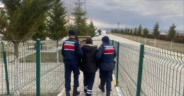 Gendarmerie officers escort a captured FETÖ suspect, Yozgat, central Türkiye, March 7, 2026. (İHA Photo)