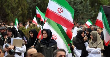 Members of Iranian health care personnel holding Iranian flags take part in a protest against U.S.-Israeli attacks in Tehran, Iran, April 6, 2026. (EPA Photo)