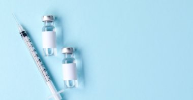 An image of a vaccine in vials and syringe. (Shutterstock Photo)
