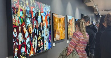 Visitors explore İzzet Keribar’s “Prague and Bohemia — Light Reflected from History” exhibition in Istanbul, Türkiye, April 3, 2026. (AA Photo)