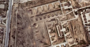 A satellite image shows a large crater on a bunkered storage area at Bushehr airbase, following reported airstrikes, amid the U.S.-Israeli attacks, Iran, March 7, 2026. (Reuters Photo)