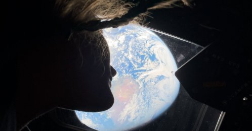 Artemis II mission specialist Christina Koch looking back at earth through the window of the Orion spacecraft, April, 2, 2026. (AFP Photo)