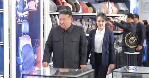 This undated photo shows North Korean leader Kim Jong Un (L) and his daughter Kim Ju Ae inspecting an automobile technical service center in Pyongyang, North Korea.