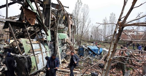 Officials and media representatives gather around the damaged building of the Shahid Beheshti University following a strike, Tehran, Iran, April 4, 2026. (AFP Photo)
