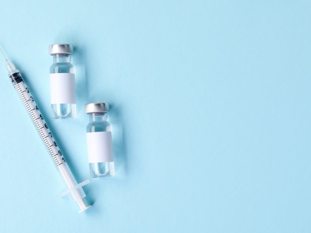 An image of a vaccine in vials and syringe. (Shutterstock Photo)