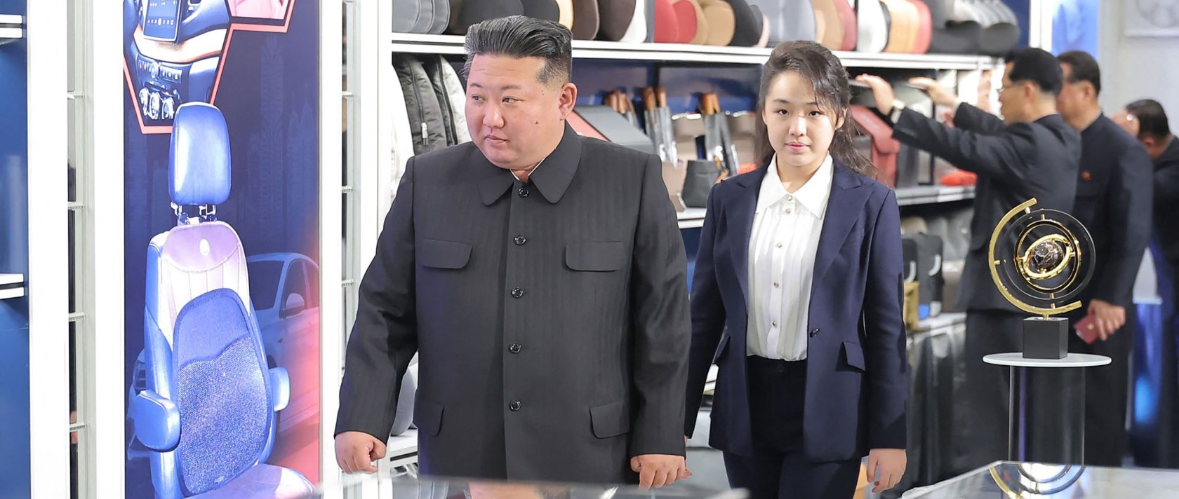 This undated photo shows North Korean leader Kim Jong Un (L) and his daughter Kim Ju Ae inspecting an automobile technical service center in Pyongyang, North Korea.