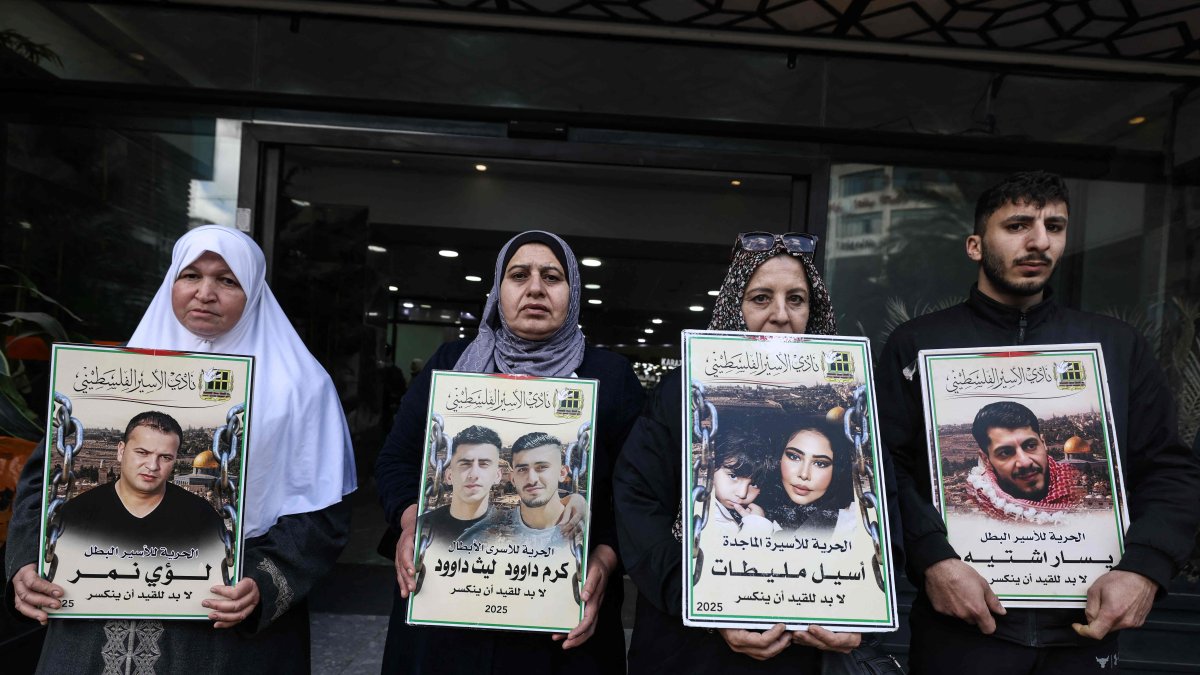 Relatives of Palestinian prisoners hold portraits during a rally in the Israeli-occupied West Bank city of Nablus, Palestine, March 31, 2026. (AFP Photo)