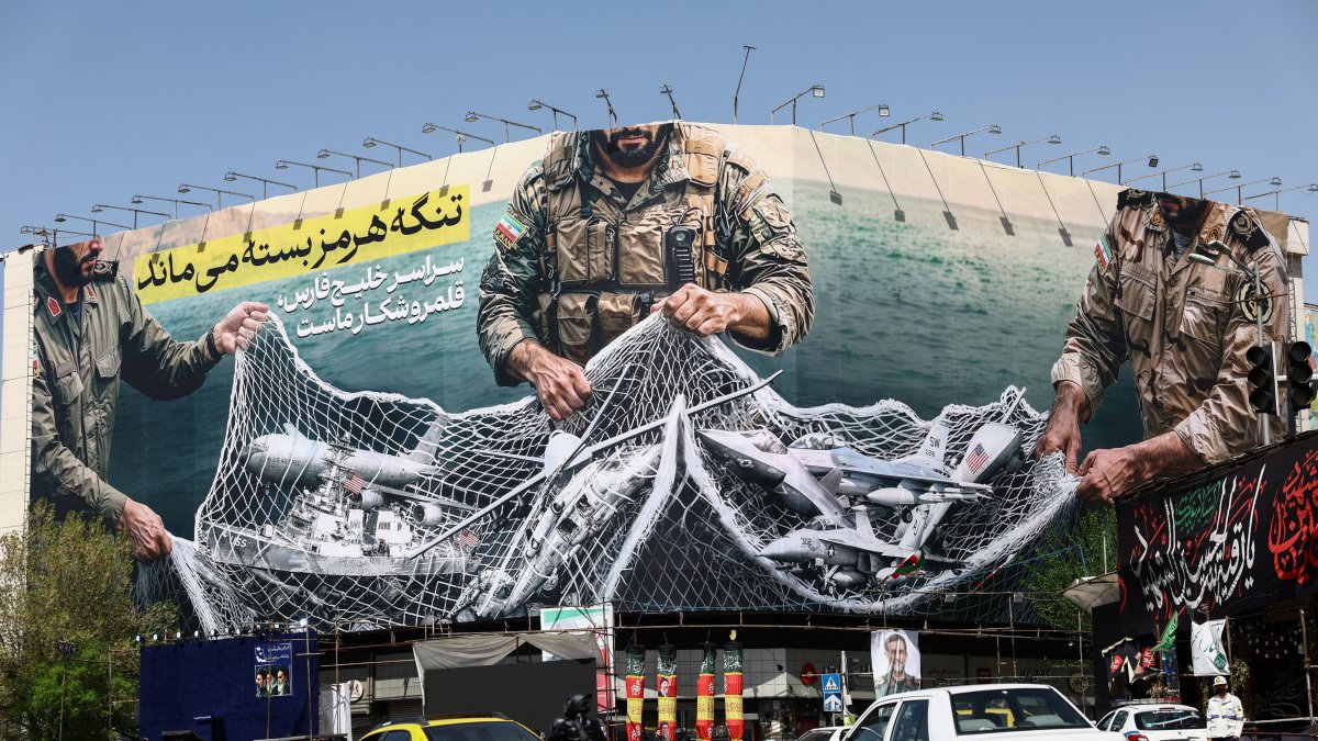 Cars drive near an anti-U.S. billboard, amid the U.S.-Israeli conflict with Iran, Tehran, Iran, April 5, 2026. (Reuters Photo)