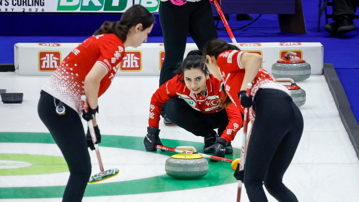 Türkiye's skip Dilşat Yıldız (C) directs her teammates, second Iclal Karaman (R) and lead Berfin Şengül against Japan during qualifying at the World Women's Curling Championship, Calgary, Canada, March 21, 2026. (AP Photo)