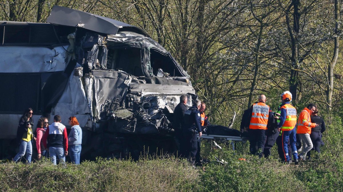 Firefighters and police officers transport a person from the wreckage of a TGV train after its collision at a level crossing with a lorry between Bethune and Lens, in Bully-les-Mines, in the Pas-de-Calais region, northern France, April 7, 2026. (AFP Photo)