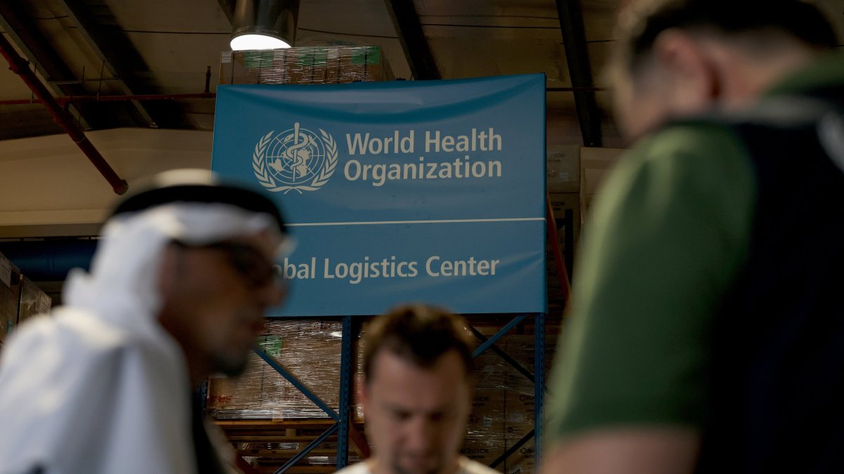 The World Health Organization (WHO) workers seen at the Dubai Humanitarian warehouse in Dubai, United Arab Emirates, April 1, 2026. (EPA Photo)