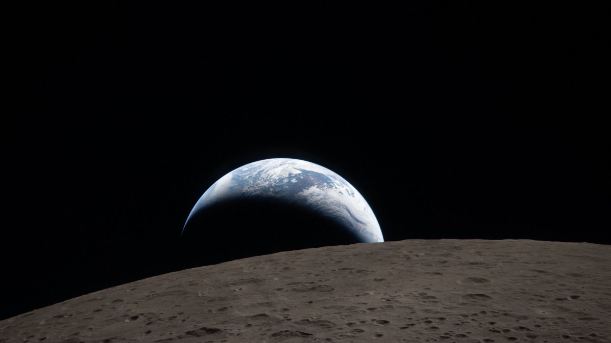 This handout picture released on April 7, 2026, by NASA shows Earth as it dips beyond the lunar horizon, also known as "Earthset," as seen from the Orion spacecraft on April 6, 2026. (AFP Photo)