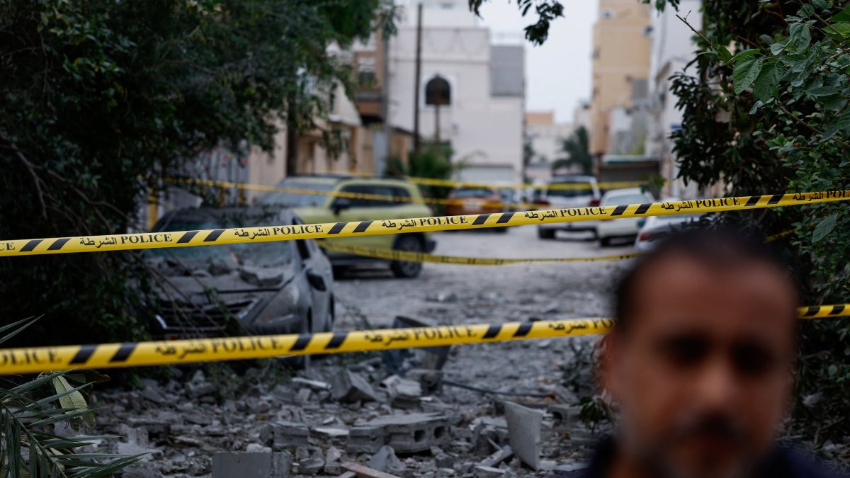 A wrecked car near damaged buildings at the site of an impact of what Bahrain's Ministry of Interior (MOI) said was falling debris of an intercepted Iranian drone last night, amid the U.S.-Israeli conflict with Iran, in Sitra, Bahrain, April 4, 2026. (Reuters Photo)