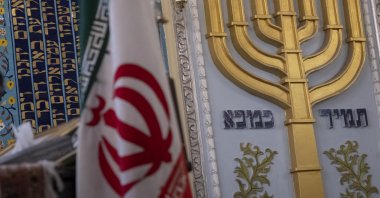 An Iranian flag is pictured alongside a Menorah during a gathering at a synagogue in downtown Tehran, Iran, Oct. 30, 2023. (Getty Images)