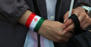 An Iranian nurse wears Iran's national flags on her hand during a protest against U.S.-Israeli attacks in Tehran, Iran, April 6, 2026. (EPA Photo)