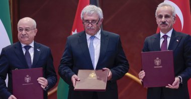 Transport and Infrastructure Minister Abdulkadir Uraloğlu (R) poses with his Jordanian counterpart Nidal Qatamin (C) and Syrian Transport Minister Yarub Badr, Amman, Jordan, April 7, 2026. (AA Photo)