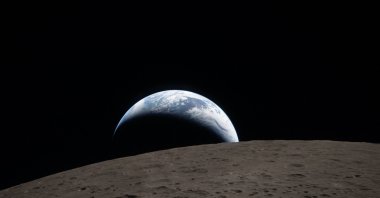 This handout picture released on April 7, 2026, by NASA shows Earth as it dips beyond the lunar horizon, also known as "Earthset," as seen from the Orion spacecraft on April 6, 2026. (AFP Photo)
