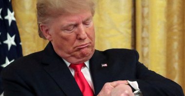 U.S. President Donald Trump checks his watch during an event to celebrate federal judicial confirmations in the East Room of the White House in Washington, D.C., U.S., Nov. 6, 2019. (Reuters Photo)