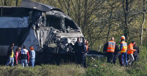 Firefighters and police officers transport a person from the wreckage of a TGV train after its collision at a level crossing with a lorry between Bethune and Lens, in Bully-les-Mines, in the Pas-de-Calais region, northern France, April 7, 2026. (AFP Photo)