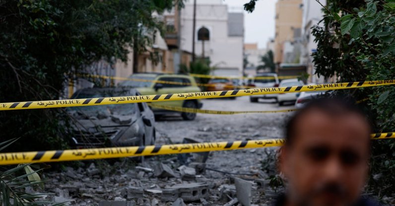 A wrecked car near damaged buildings at the site of an impact of what Bahrain's Ministry of Interior (MOI) said was falling debris of an intercepted Iranian drone last night, amid the U.S.-Israeli conflict with Iran, in Sitra, Bahrain, April 4, 2026. (Reuters Photo)