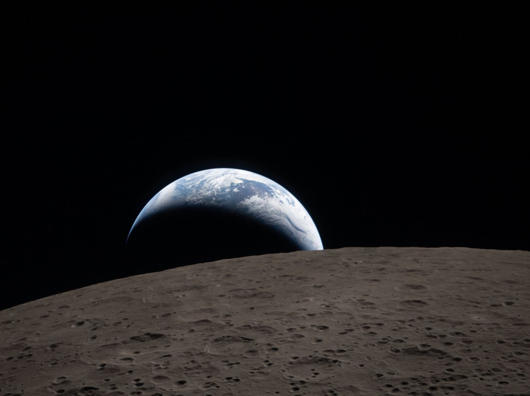 This handout picture released on April 7, 2026, by NASA shows Earth as it dips beyond the lunar horizon, also known as "Earthset," as seen from the Orion spacecraft on April 6, 2026. (AFP Photo)