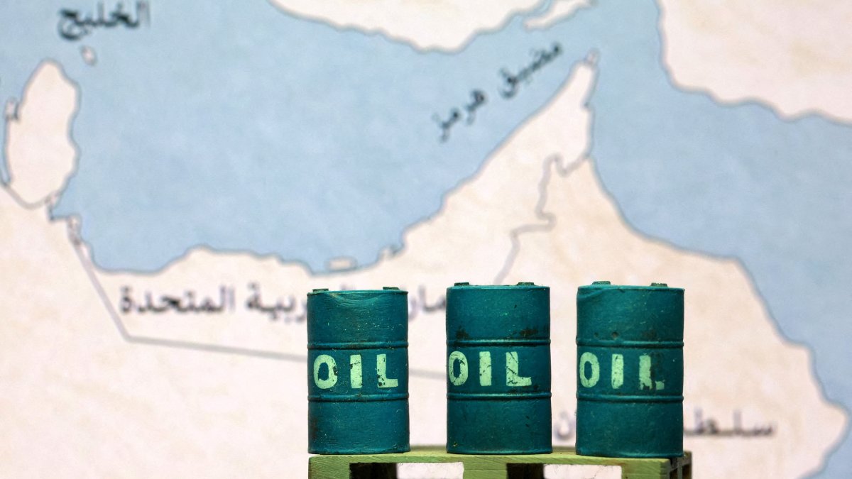 A map showing the Strait of Hormuz, also known as Madiq Hurmuz, and 3D printed oil barrels are seen in this illustration taken on March 26, 2026. (Reuters Photo)