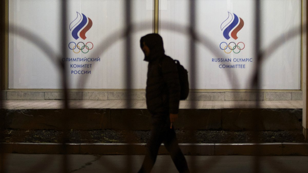 A man walks by the Russian Olympic Committee building, Moscow, Russia, Nov. 9, 2015. (AP Photo)