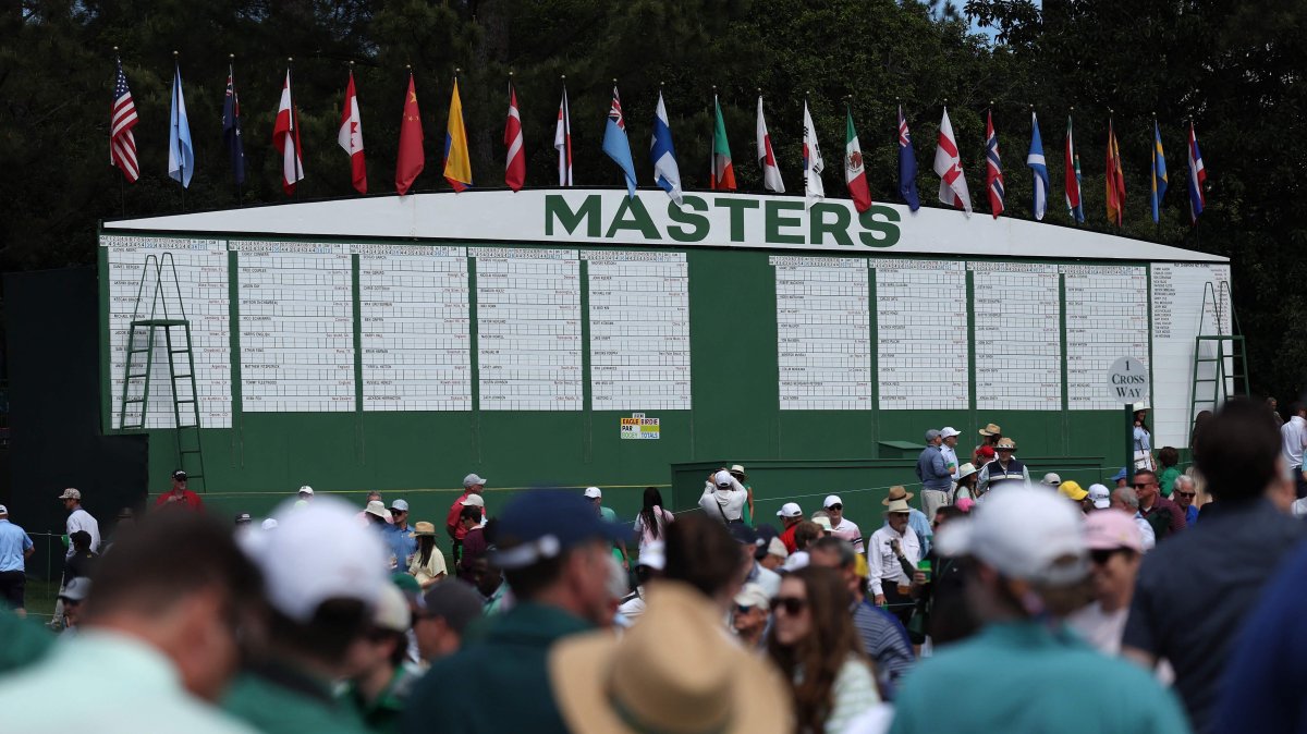 Patrons walk the grounds near the main leaderboard during a practice round before the 2026 Masters Tournament at Augusta National Golf Club, Augusta, U.S., April 7, 2026. (AFP Photo)