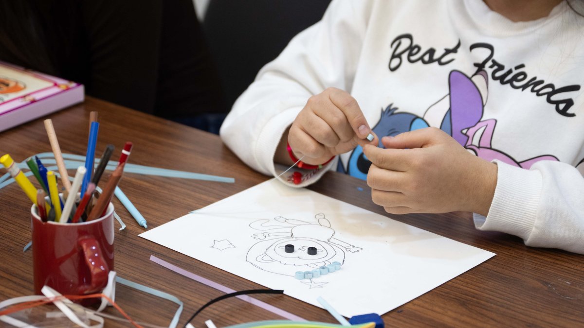 A child participates in a painting activity as part of an art workshop supporting creative development, Ankara, Türkiye, April 4, 2026. (AA Photo) 