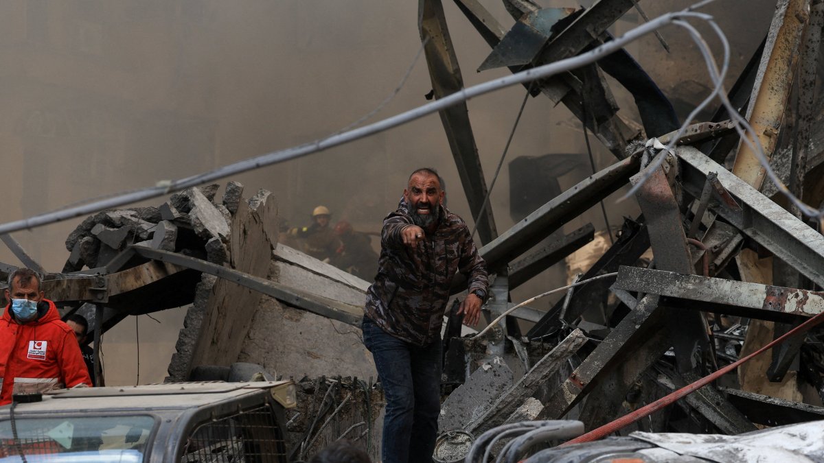 A man gestures as rescuers work at the site of an Israeli strike in Beirut, Lebanon, April 8, 2026. (Reuters Photo)