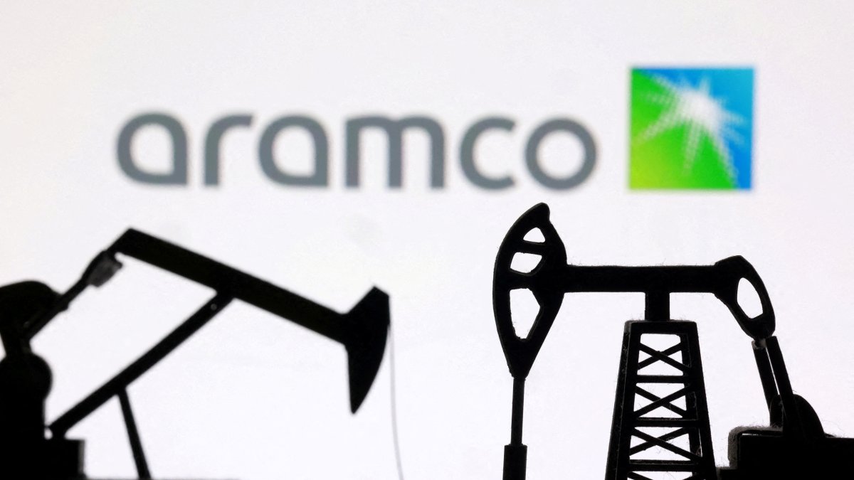 3D-printed oil pump jacks and the Saudi Aramco logo appear in this illustration, March 2, 2026. (Reuters Photo)