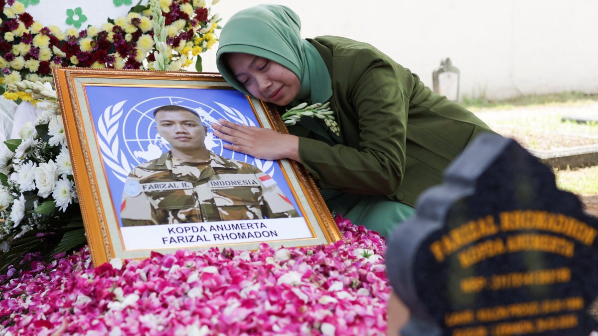 Azila Farizal reacts next to the photograph of her husband, Farizal Rhomadhon, a UNIFIL peacekeeper killed in Lebanon, Yogyakarta, Indonesia, April 5, 2026. (Reuters Photo)