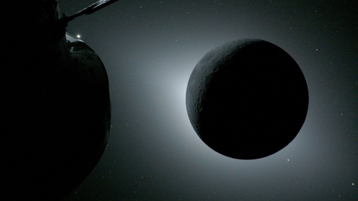 The Orion spacecraft (L) and the Moon backlit by the Sun during a solar eclipse on April 6, 2026. (AFP Photo)