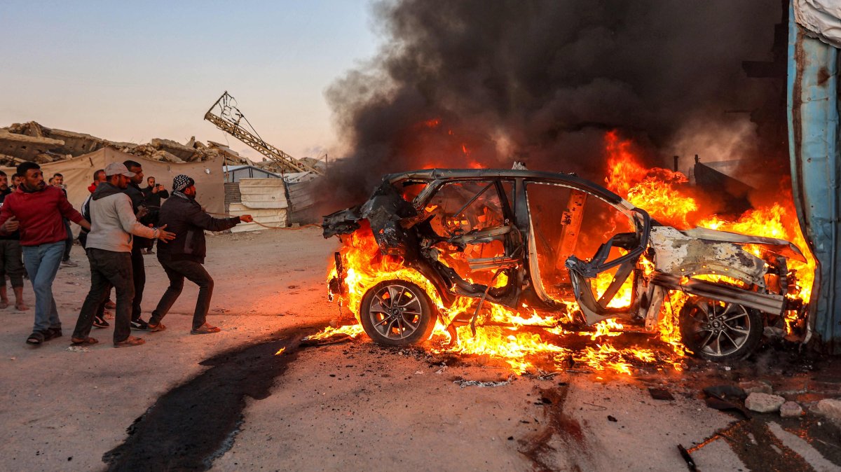 Flames rise after a strike on the vehicle of Palestinian journalist Mohammed Washeha in southern Gaza City, April 8, 2026. (AFP Photo)