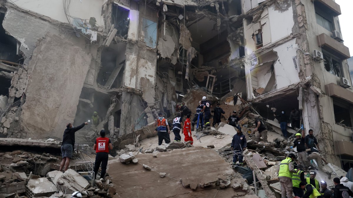 First responders search for missing people under the rubble of a partially destroyed residential building following an Israeli airstrike, in the Tallet al-Khayat neighborhood of Beirut, Lebanon, April 8, 2026. (EPA Photo)