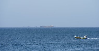 Vessels and boats are off the coast of Musandam governorate, overlooking the Strait of Hormuz, Oman, April 8, 2026. (Reuters Photo)
