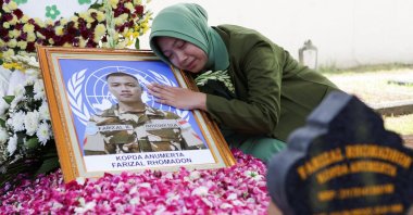Azila Farizal reacts next to the photograph of her husband, Farizal Rhomadhon, a UNIFIL peacekeeper killed in Lebanon, Yogyakarta, Indonesia, April 5, 2026. (Reuters Photo)