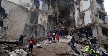 First responders search for missing people under the rubble of a partially destroyed residential building following an Israeli airstrike, in the Tallet al-Khayat neighborhood of Beirut, Lebanon, April 8, 2026. (EPA Photo)